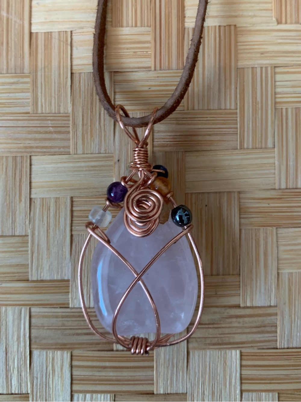 2 necklace lot- Rose Quartz Pendant w Brown Cord & gold chain with blue stone